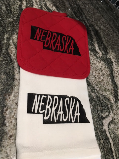 Nebraska in State Towel with red hot pad