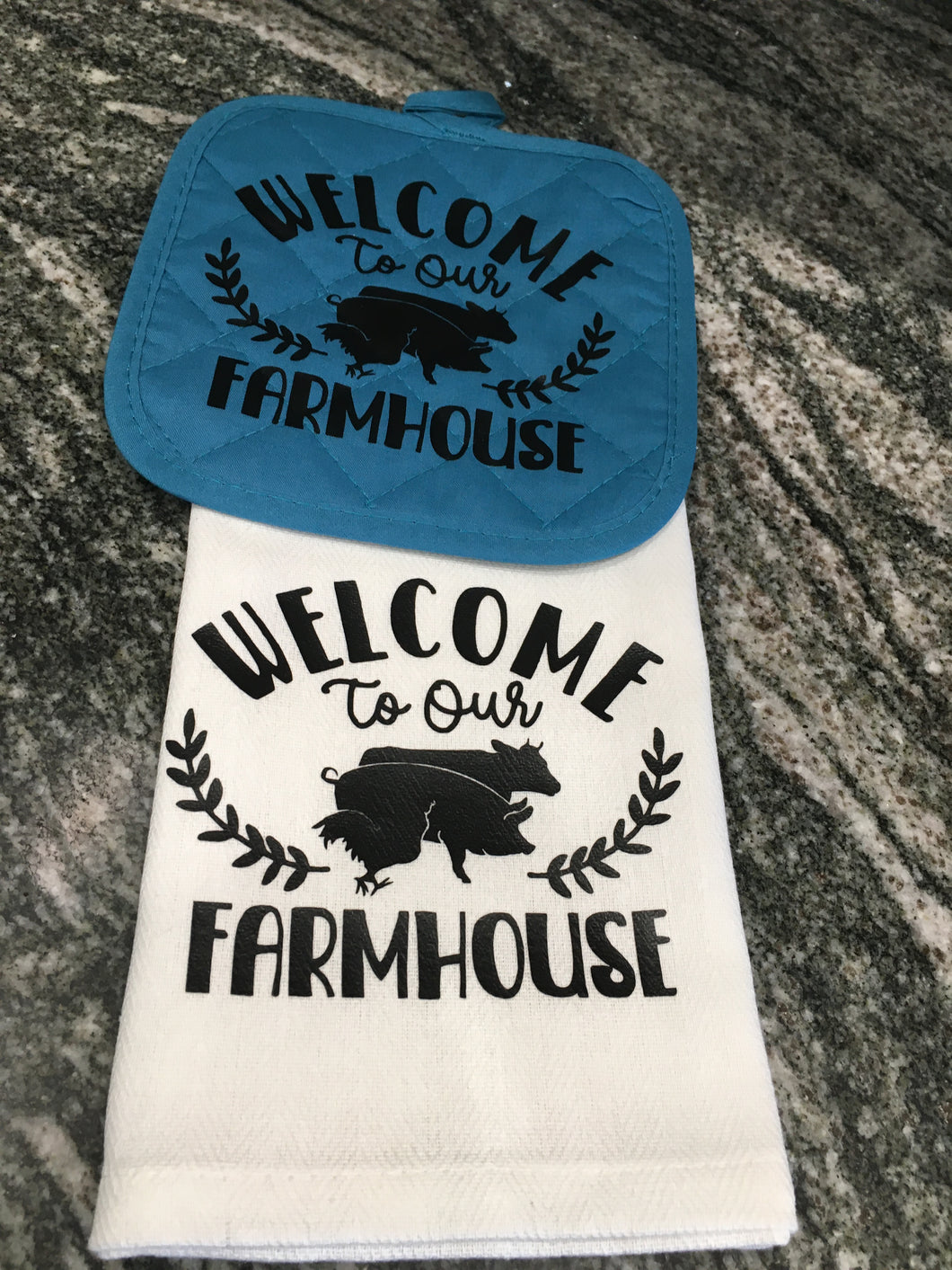 Welcome to our Farmhouse towel with a teal hot pad